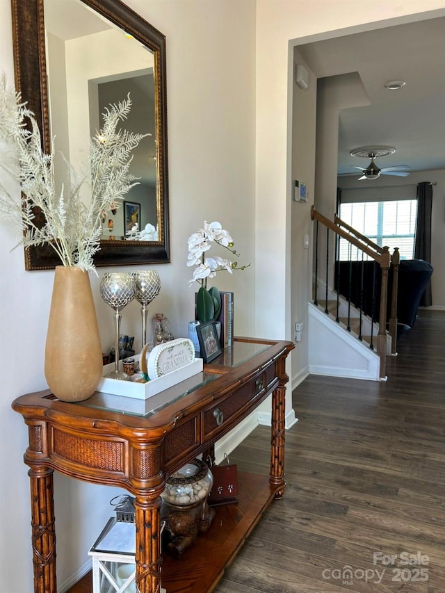 interior space with hardwood / wood-style floors and ceiling fan