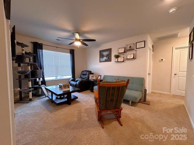 living room featuring light carpet and ceiling fan