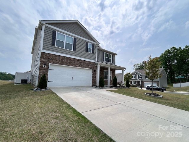 traditional-style house with a front yard, cooling unit, driveway, and an attached garage