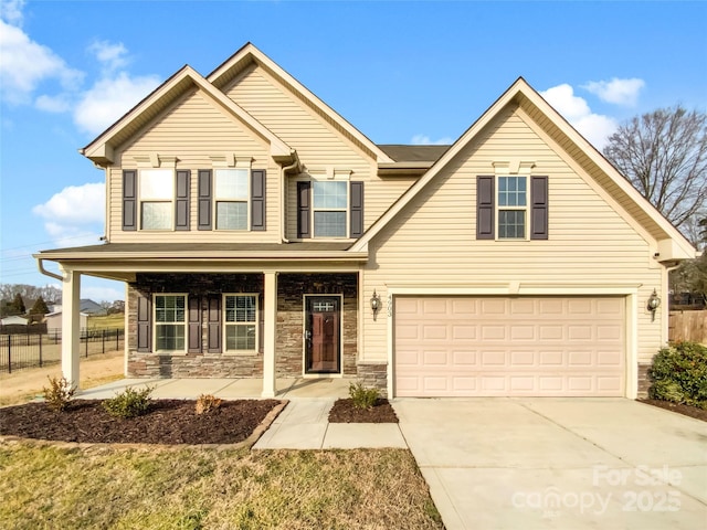 view of front of home with a garage and covered porch