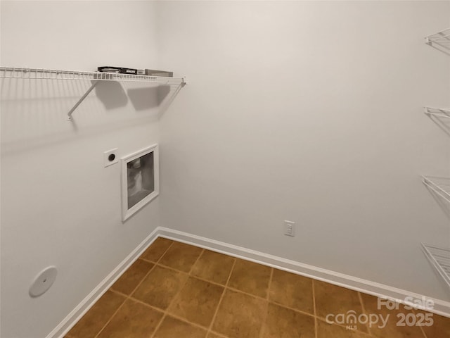 laundry room featuring electric dryer hookup and tile patterned flooring