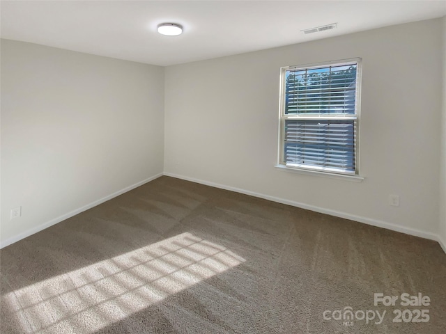 unfurnished room featuring carpet floors