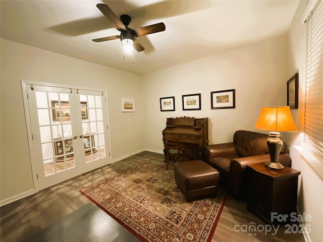 sitting room featuring french doors and ceiling fan