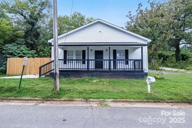 bungalow-style house with a porch and a front yard