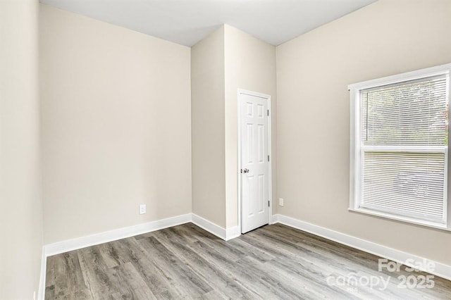 unfurnished room featuring wood-type flooring