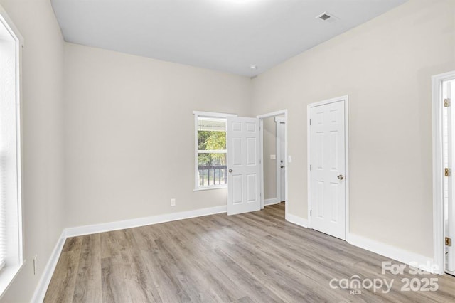 unfurnished bedroom with light hardwood / wood-style floors