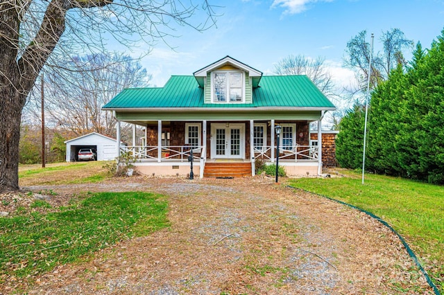 view of front facade featuring a porch, a garage, and a front yard