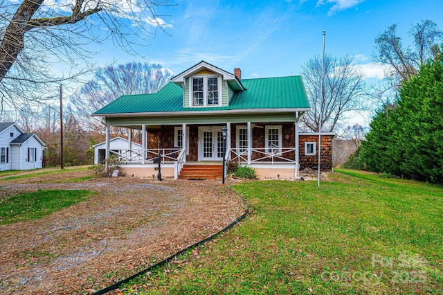 view of front facade with a porch and a front lawn