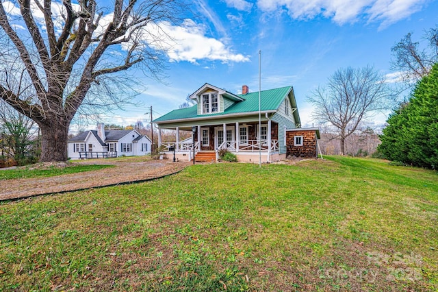 view of front of home featuring a front lawn and covered porch