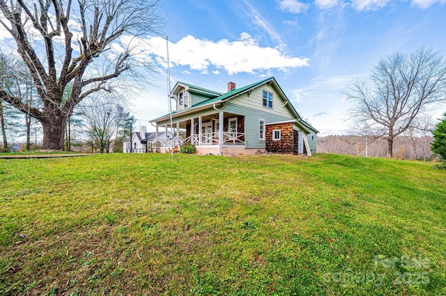 exterior space featuring a front yard and covered porch