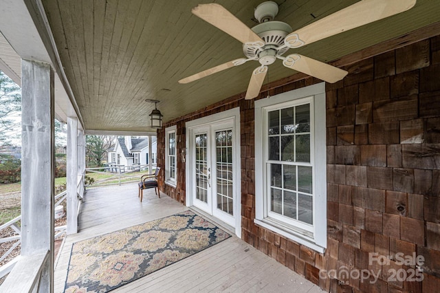 deck with french doors and covered porch