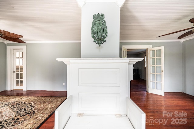 interior space featuring hardwood / wood-style flooring, crown molding, and ceiling fan