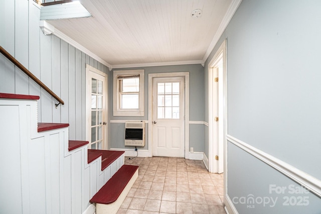 doorway featuring ornamental molding, heating unit, and light tile patterned floors