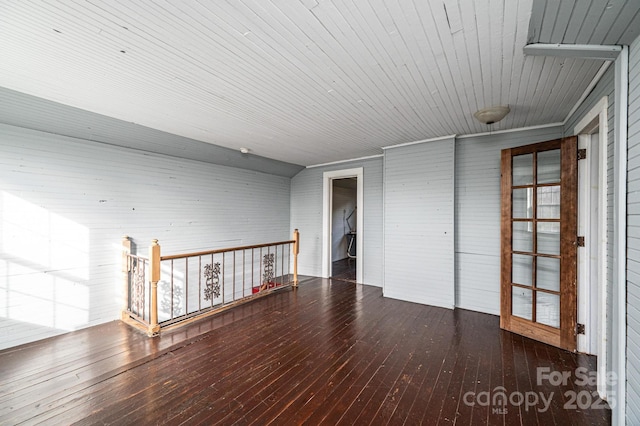 empty room with dark hardwood / wood-style floors