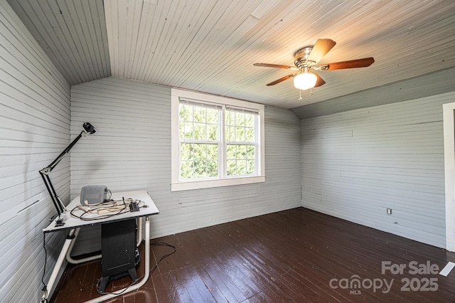 interior space featuring lofted ceiling, dark hardwood / wood-style floors, wooden ceiling, and ceiling fan