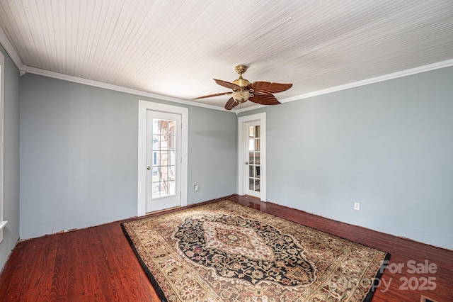 empty room featuring ornamental molding, hardwood / wood-style floors, and ceiling fan