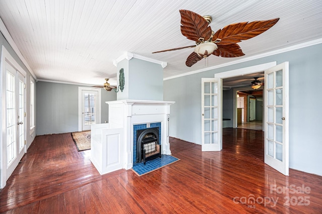 unfurnished living room with dark hardwood / wood-style floors, ceiling fan, wood ceiling, crown molding, and french doors