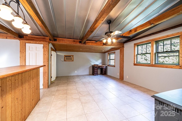 unfurnished living room with plenty of natural light, a wall unit AC, light tile patterned floors, and ceiling fan