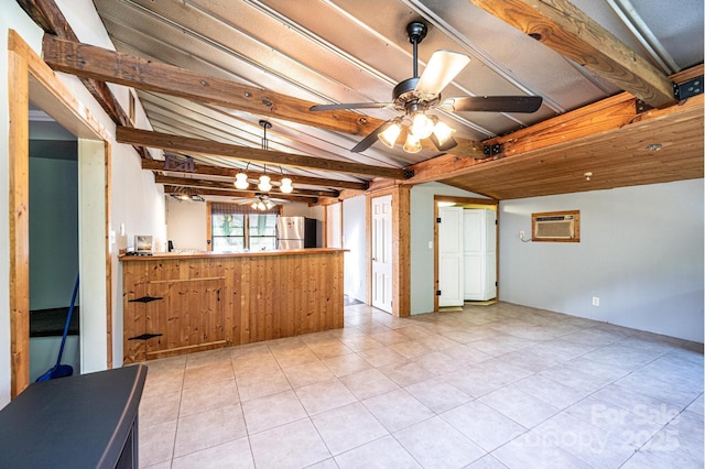 kitchen with stainless steel refrigerator, ceiling fan, kitchen peninsula, and vaulted ceiling with beams