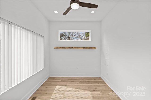 empty room featuring light wood-style floors, ceiling fan, baseboards, and recessed lighting