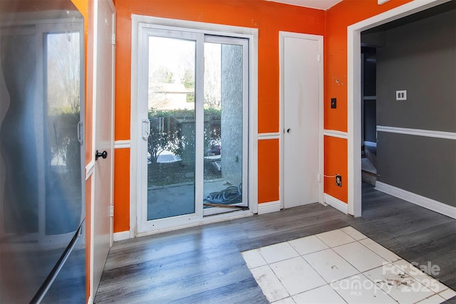 entryway with light hardwood / wood-style flooring