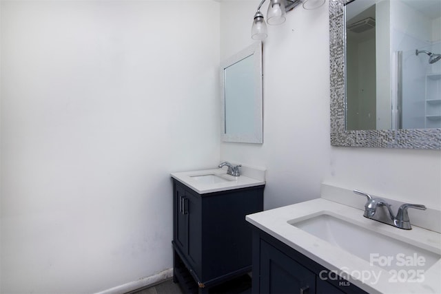 bathroom featuring vanity and a shower