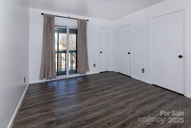 empty room featuring dark hardwood / wood-style floors