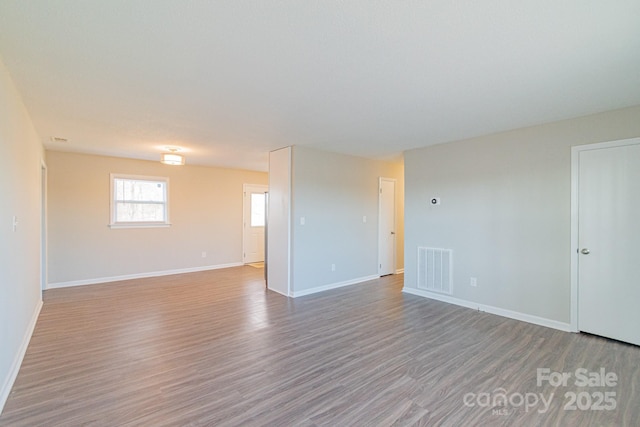 empty room with light wood-type flooring