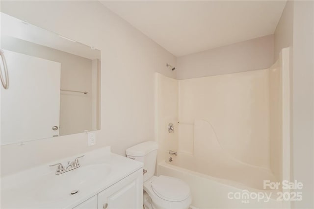 full bathroom with vanity, shower / bathtub combination, and toilet