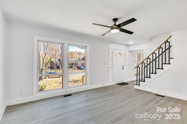 foyer featuring ceiling fan and hardwood / wood-style floors