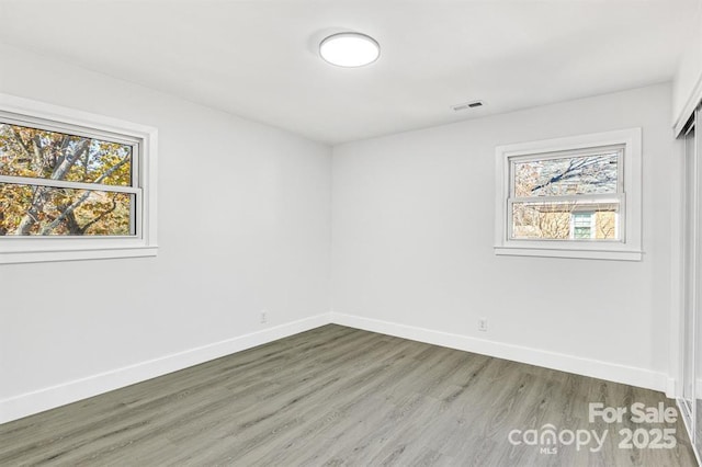 spare room featuring hardwood / wood-style flooring