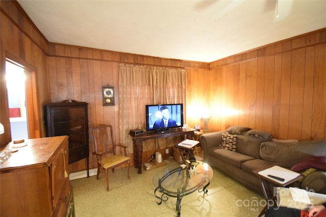 living room featuring carpet flooring and wood walls