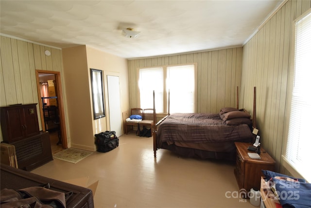 bedroom with wood walls