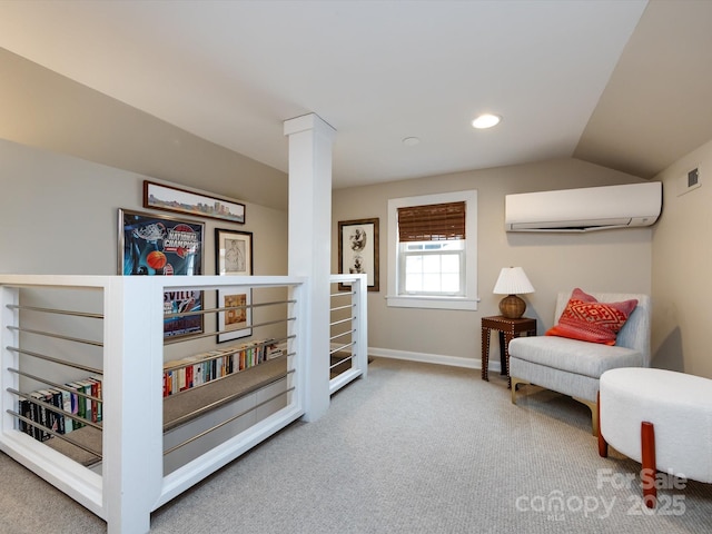 living area with lofted ceiling, a wall mounted air conditioner, and carpet flooring