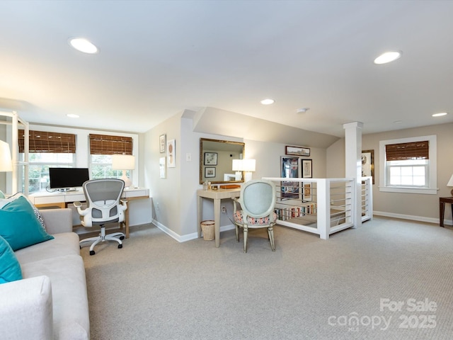 carpeted home office featuring ornate columns