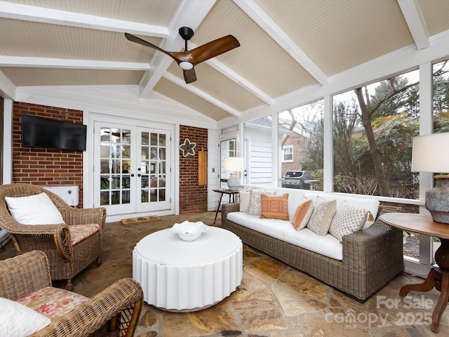 sunroom featuring french doors, ceiling fan, and vaulted ceiling with beams