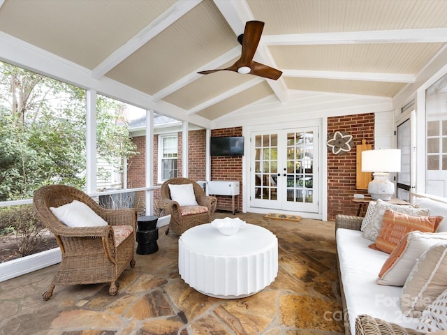 sunroom featuring french doors, ceiling fan, and lofted ceiling with beams