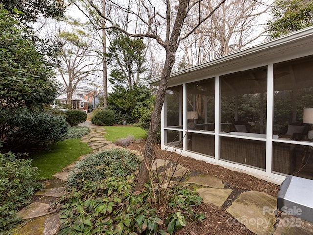 view of yard with a sunroom