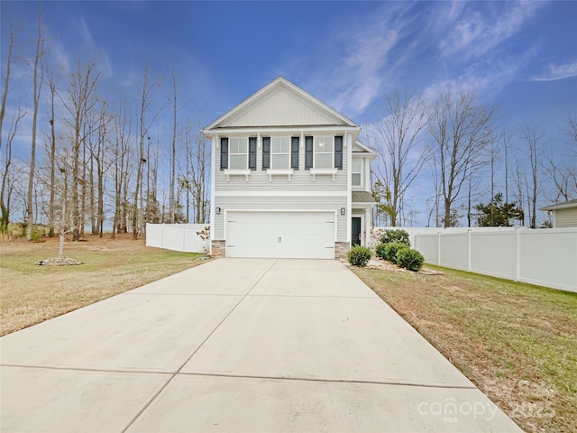 view of front facade with a garage and a front lawn