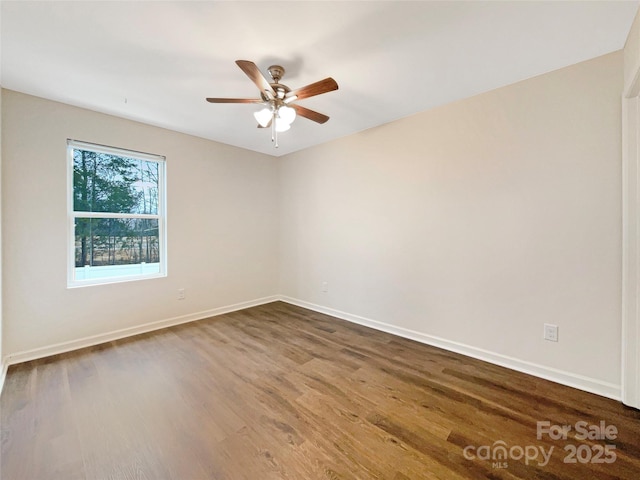 empty room with hardwood / wood-style floors and ceiling fan