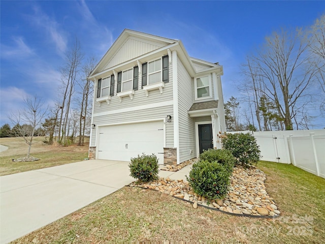 view of front of home with a garage and a front lawn