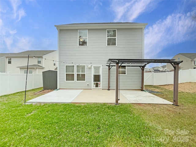 back of property featuring a lawn, a patio area, and a pergola