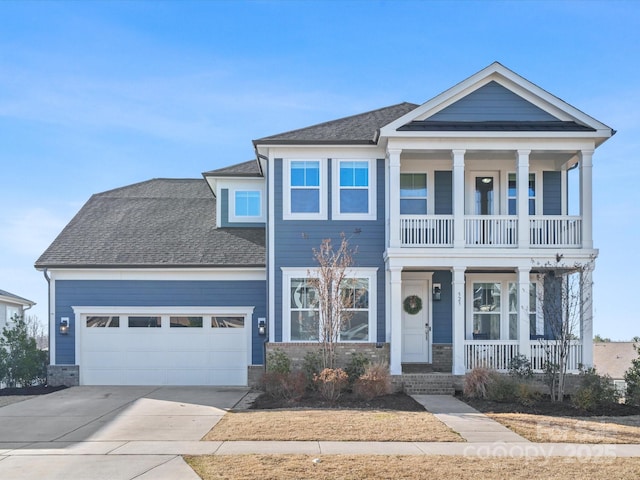 view of front of property featuring a garage and covered porch