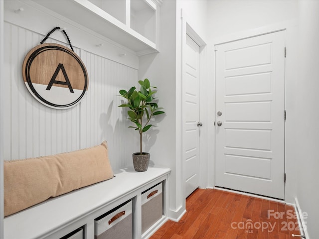 mudroom with wood-type flooring