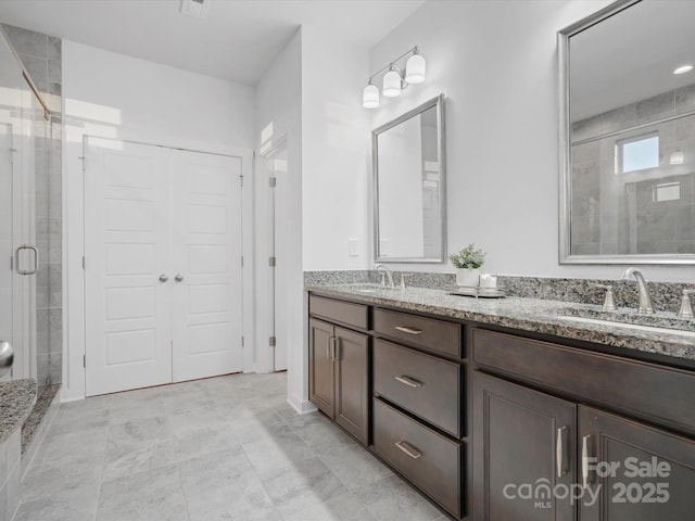 bathroom with vanity and walk in shower