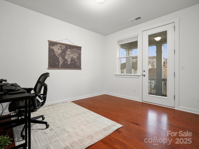 home office featuring hardwood / wood-style floors