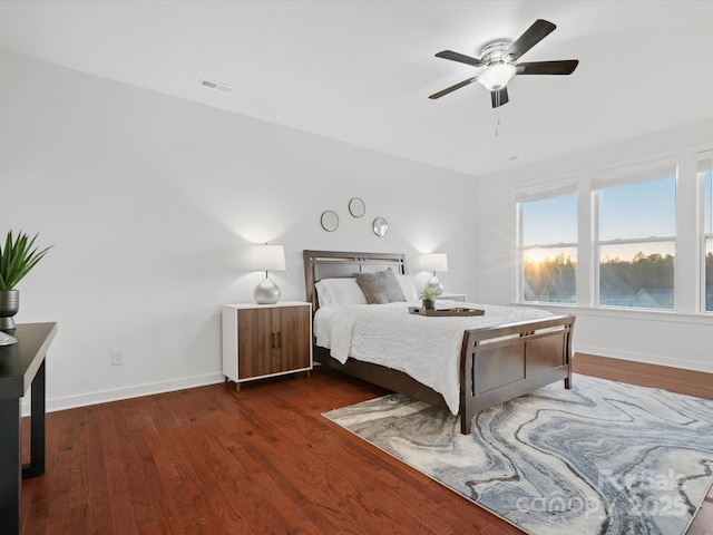 bedroom featuring dark wood-type flooring and ceiling fan