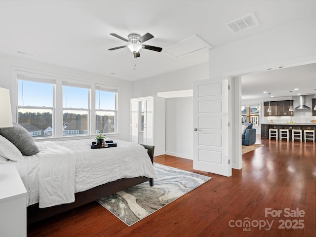 bedroom with dark hardwood / wood-style flooring