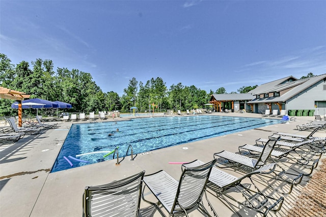 view of pool featuring a patio