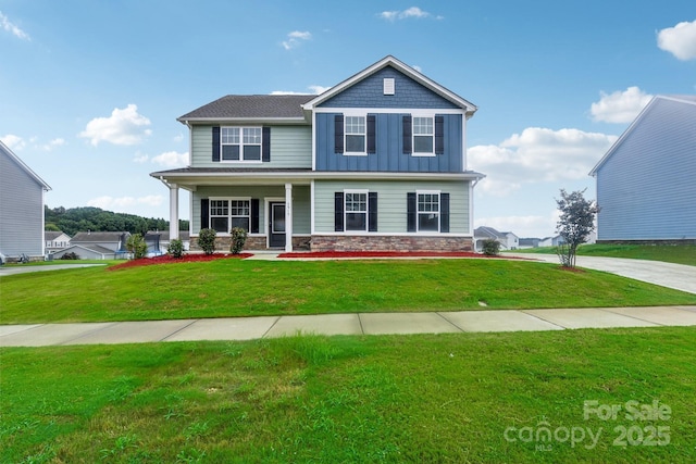 view of front of property with a front yard and covered porch